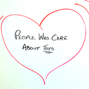 Red hear with "People Who Care About Toys" written in center
