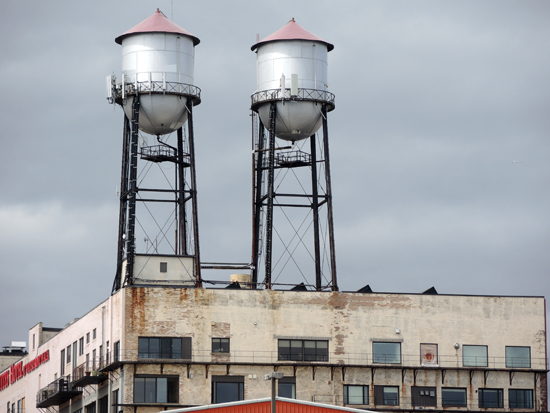Two silos on the top of a concrete building